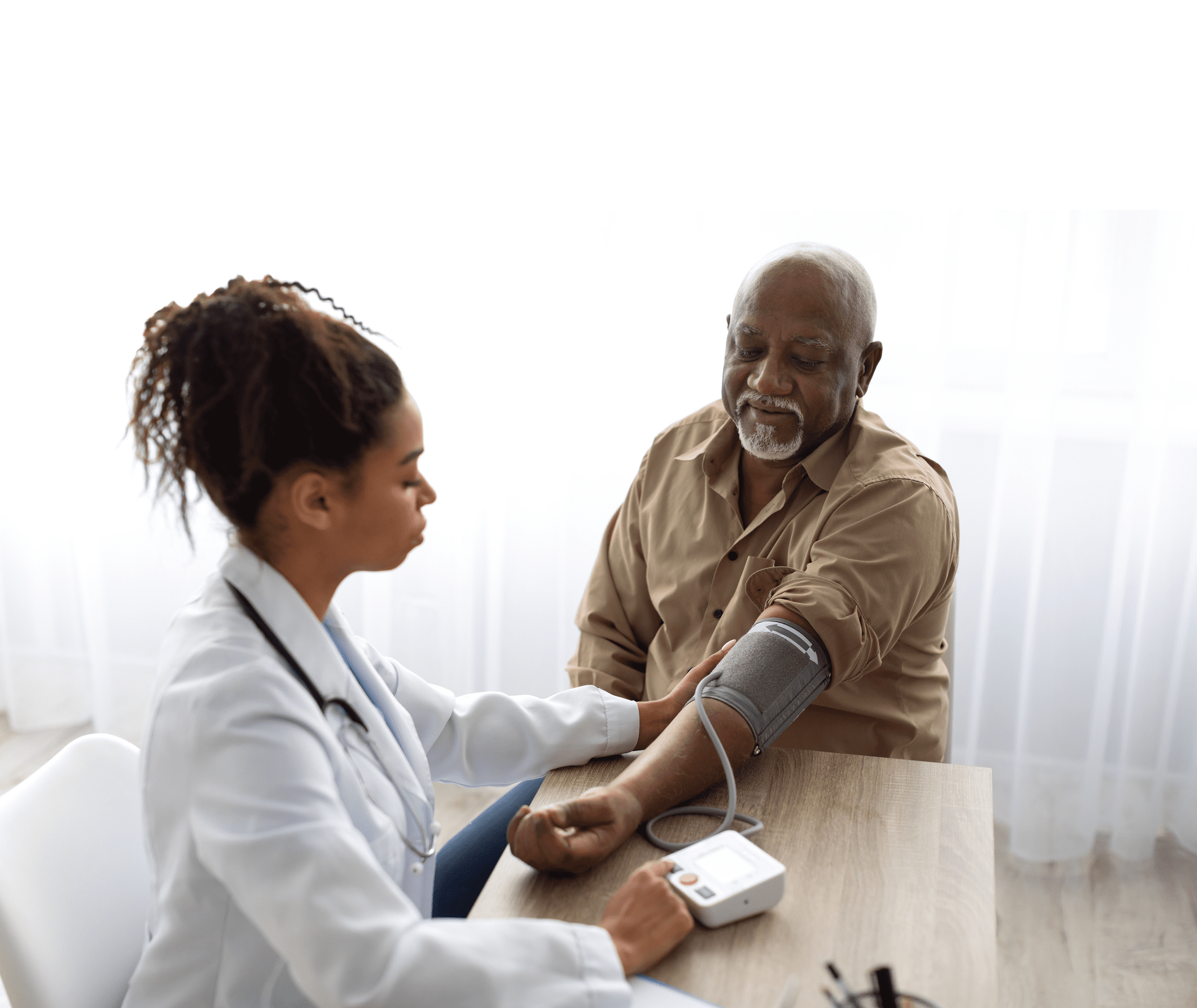Medical Worker Measuring Blood Pressure Of Senior Man
