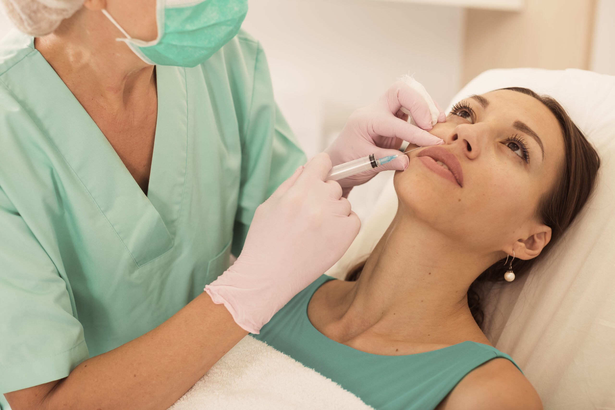 Woman Getting Injection For Facial Correction Procedure In Esthetic Clinic